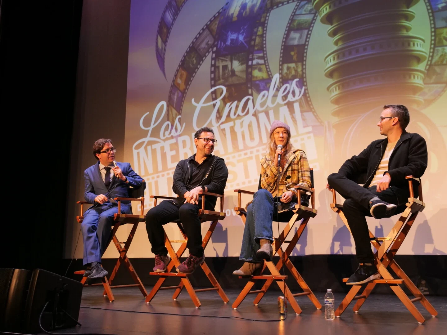 Four speakers in conversation on the LAIFF stage