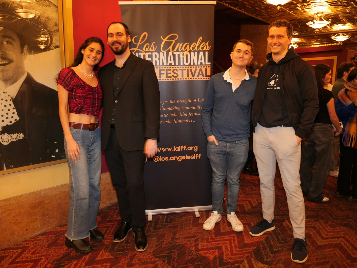 Four guests posing together at the festival